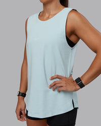 Woman wearing Go-To FLXCotton Longline Tank - Skyride-White | Size:S | Model:Tylah | Thumbnail Index: 4