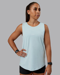 Woman wearing Go-To FLXCotton Longline Tank - Skyride-White | Size:S | Model:Tylah | Thumbnail Index: 0