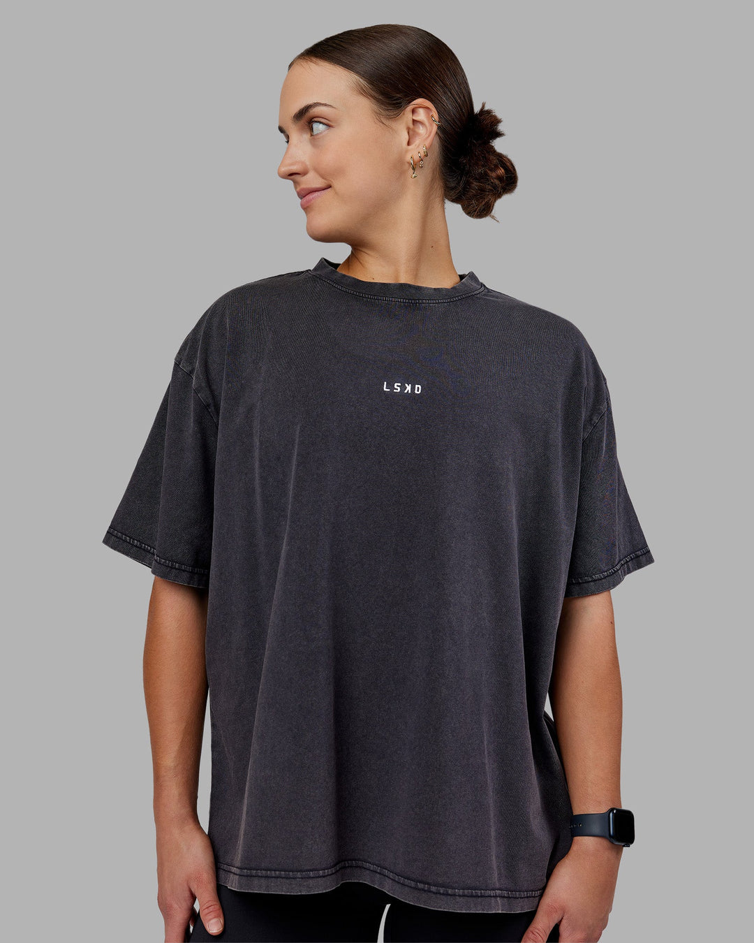 Woman wearing Go-To FLXCotton Oversized Tee - Black Washed-White | Model:Keisha | Size:S