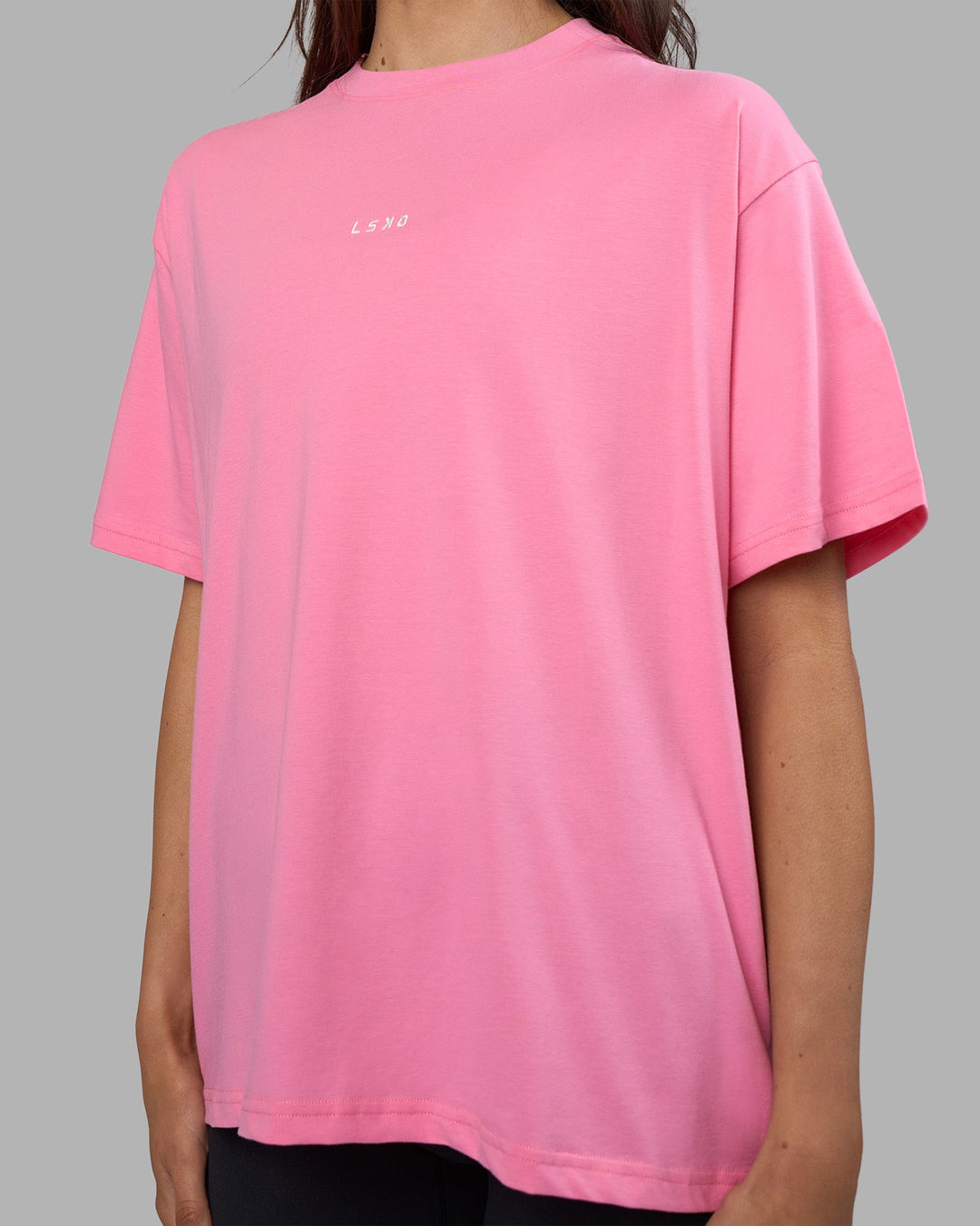Woman wearing Go-To FLXCotton Oversized Tee - Candy Pink-White | Model:Phoebe | Size:S