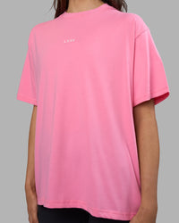Woman wearing Go-To FLXCotton Oversized Tee - Candy Pink-White | Model:Phoebe | Size:S