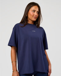Woman wearing Go-To FLXCotton Oversized Tee - Future Navy-White | Model:Bianca | Size:S