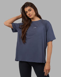 Woman wearing Go-To FLXCotton Oversized Tee - Night Shadow-White | Model:Phoebe | Size:S