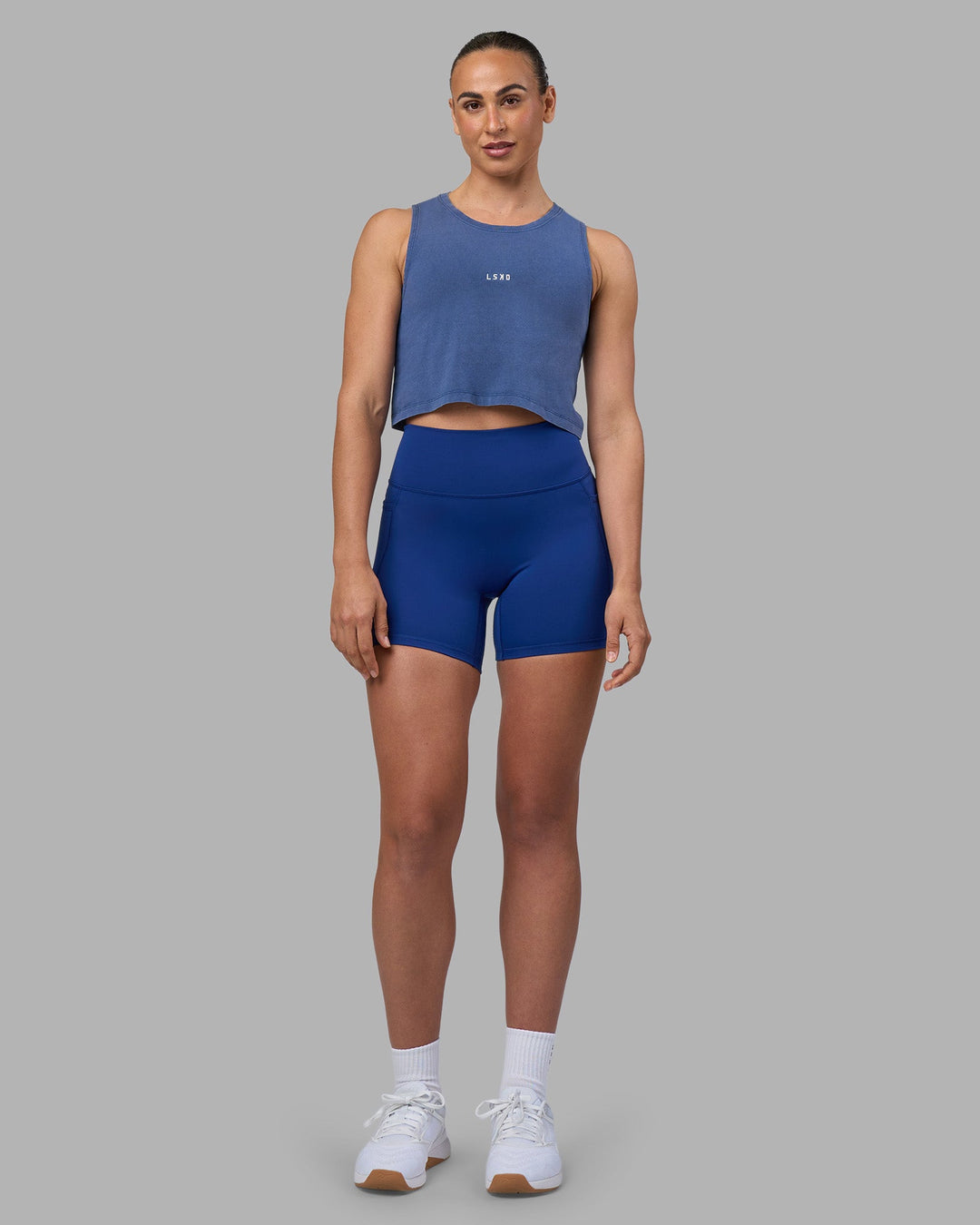Woman wearing Go-To FLXCotton Tank - Midnight Blue Washed-White | Model:Sophie | Size:S