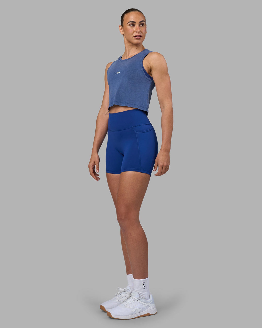 Woman wearing Go-To FLXCotton Tank - Midnight Blue Washed-White | Model:Sophie | Size:S