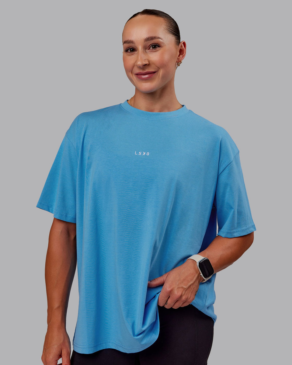 Woman wearing Go-To FLXCotton Oversized Tee in Azure Blue-White | Size:S