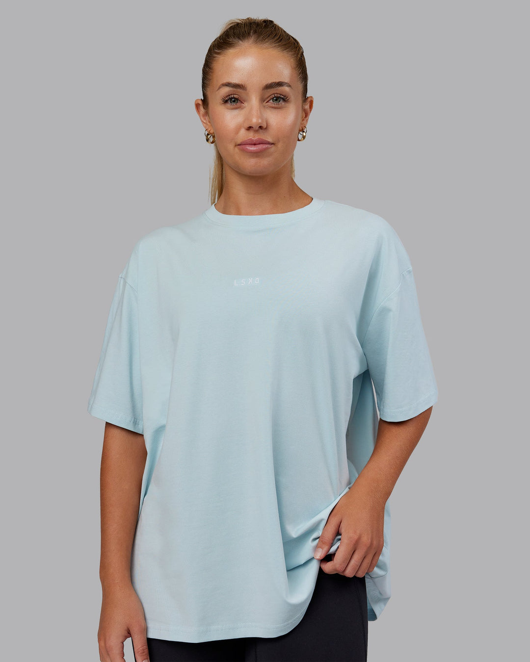 Woman wearing Go-To FLXCotton Oversized Tee - Skyride-White | Size:S | Model:Hannah