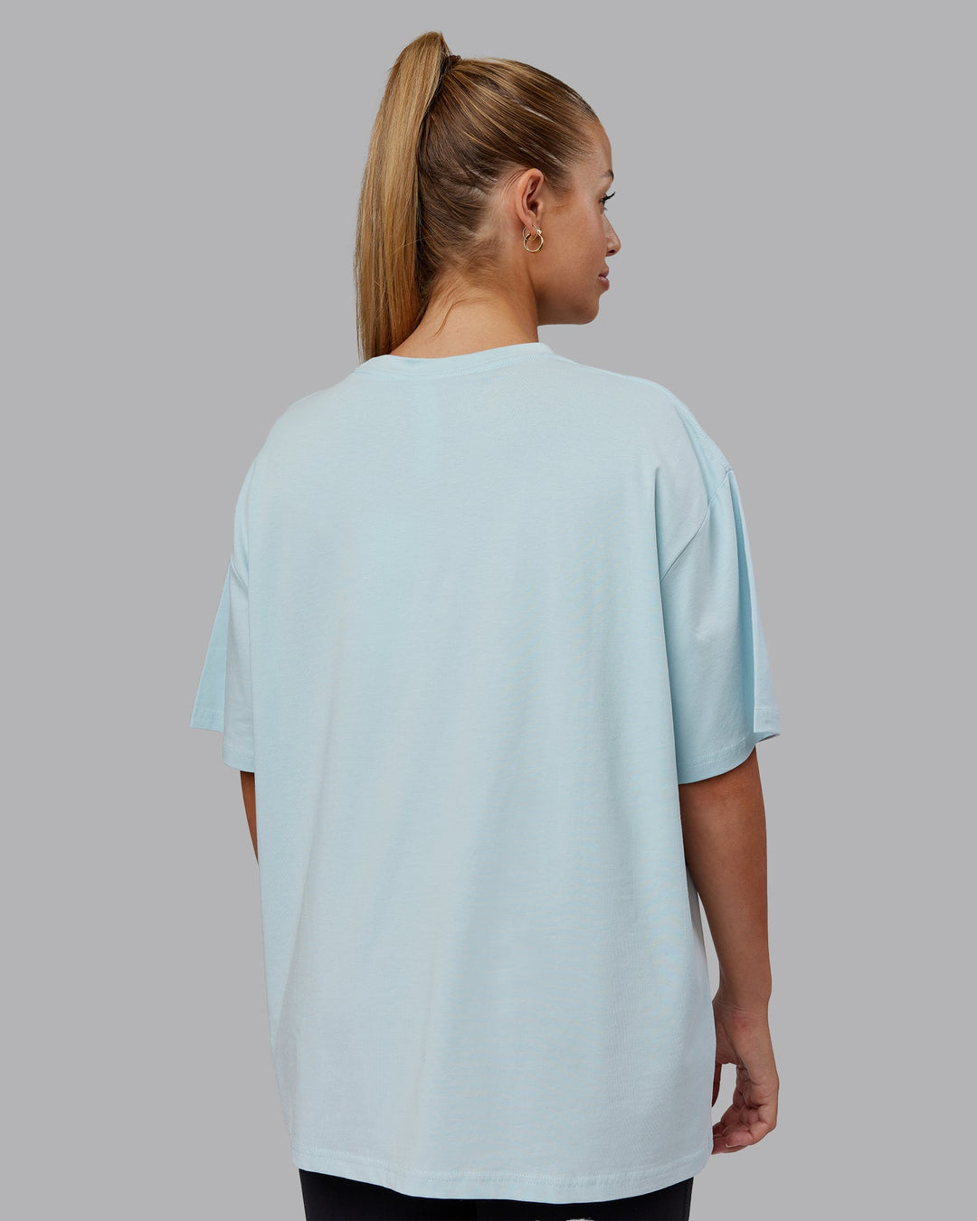 Woman wearing Go-To FLXCotton Oversized Tee - Skyride-White | Size:S | Model:Hannah