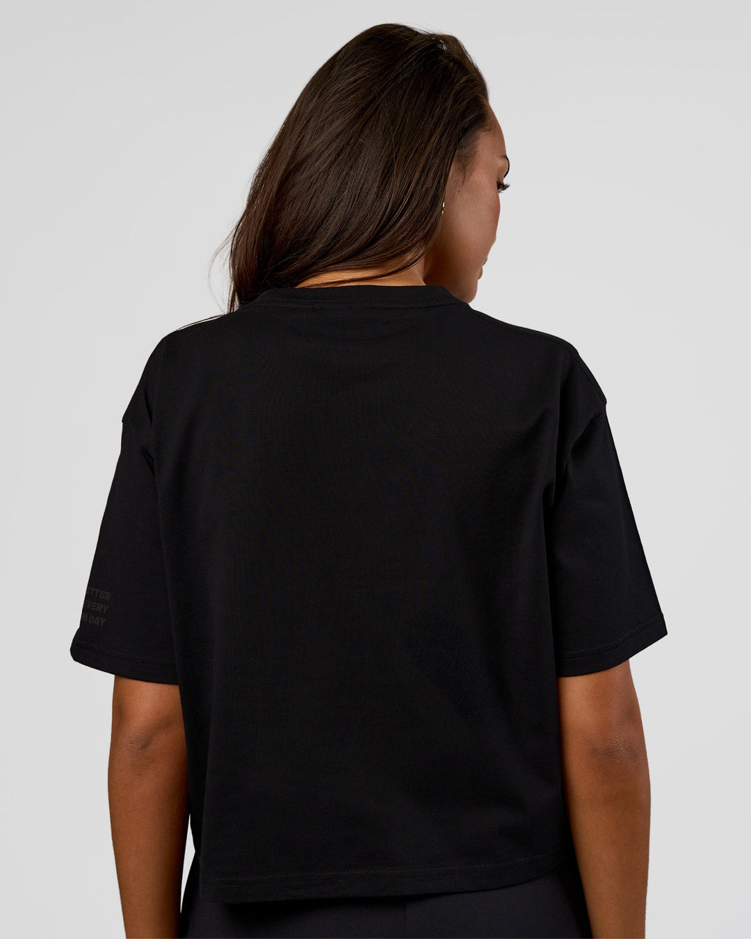 Woman wearing Go-To Heavyweight Reflective Skimmer Tee - Black-Reflective | Model:Kirstyn | Size:S