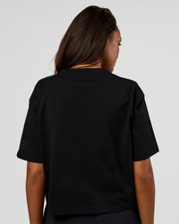 Woman wearing Go-To Heavyweight Reflective Skimmer Tee - Black-Reflective | Model:Kirstyn | Size:S