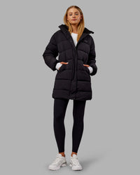 Woman wearing Go-To Puffer Long Jacket - Black | Model:Ella | Size:S