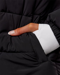 Woman wearing Go-To Puffer Long Jacket - Black | Model:Ella | Size:S