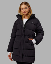 Woman wearing Go-To Puffer Long Jacket - Black | Model:Ella | Size:S