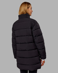 Woman wearing Go-To Puffer Long Jacket - Black | Model:Ella | Size:S