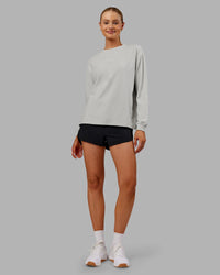 Woman wearing Go-To Long Sleeve FLXCotton Oversized Tee - Digital Mist-White | Model:Ella| Size:S | Thumbnail Index: 1