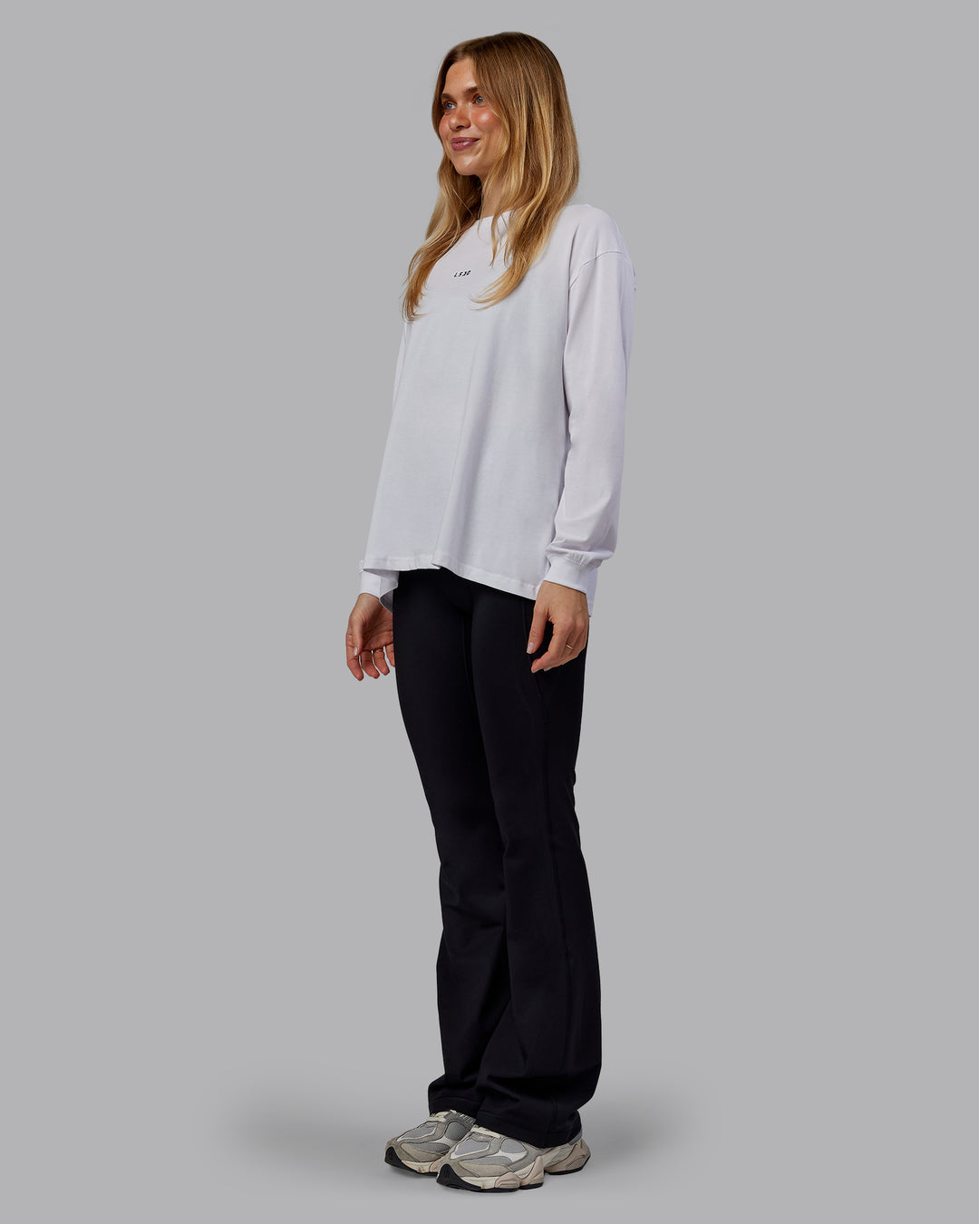 Woman wearing Go-To Long Sleeve FLXCotton Oversized Tee - White-Black | Model:Emilie | Size:S