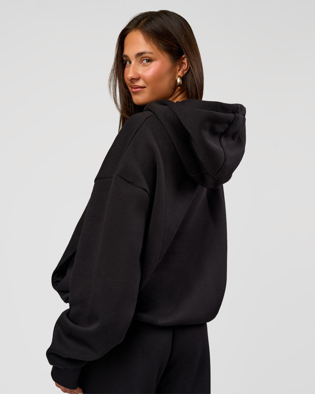 Woman wearing Go-To Oversized Hoodie - Black | Model:Bianca | Size:S