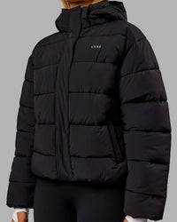 Woman wearing Go-To Puffer Jacket - Black | Model:Ella | Size:S