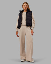 Woman wearing Go-To Puffer Vest - Black | Model:Ella | Size:S