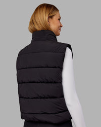 Woman wearing Go-To Puffer Vest - Black | Model:Ella | Size:S