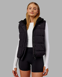 Woman wearing Go-To Puffer Vest - Black | Model:Ella | Size:S