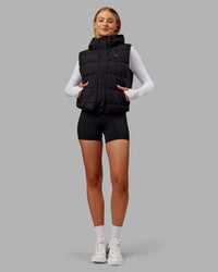 Woman wearing Go-To Puffer Vest - Black | Model:Ella | Size:S