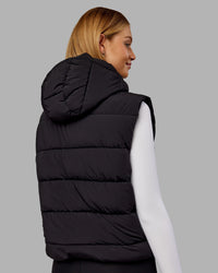 Woman wearing Go-To Puffer Vest - Black | Model:Ella | Size:S
