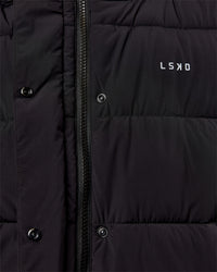 Woman wearing Go-To Puffer Vest - Black | Model:Ella | Size:S