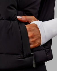 Woman wearing Go-To Puffer Vest - Black | Model:Ella | Size:S