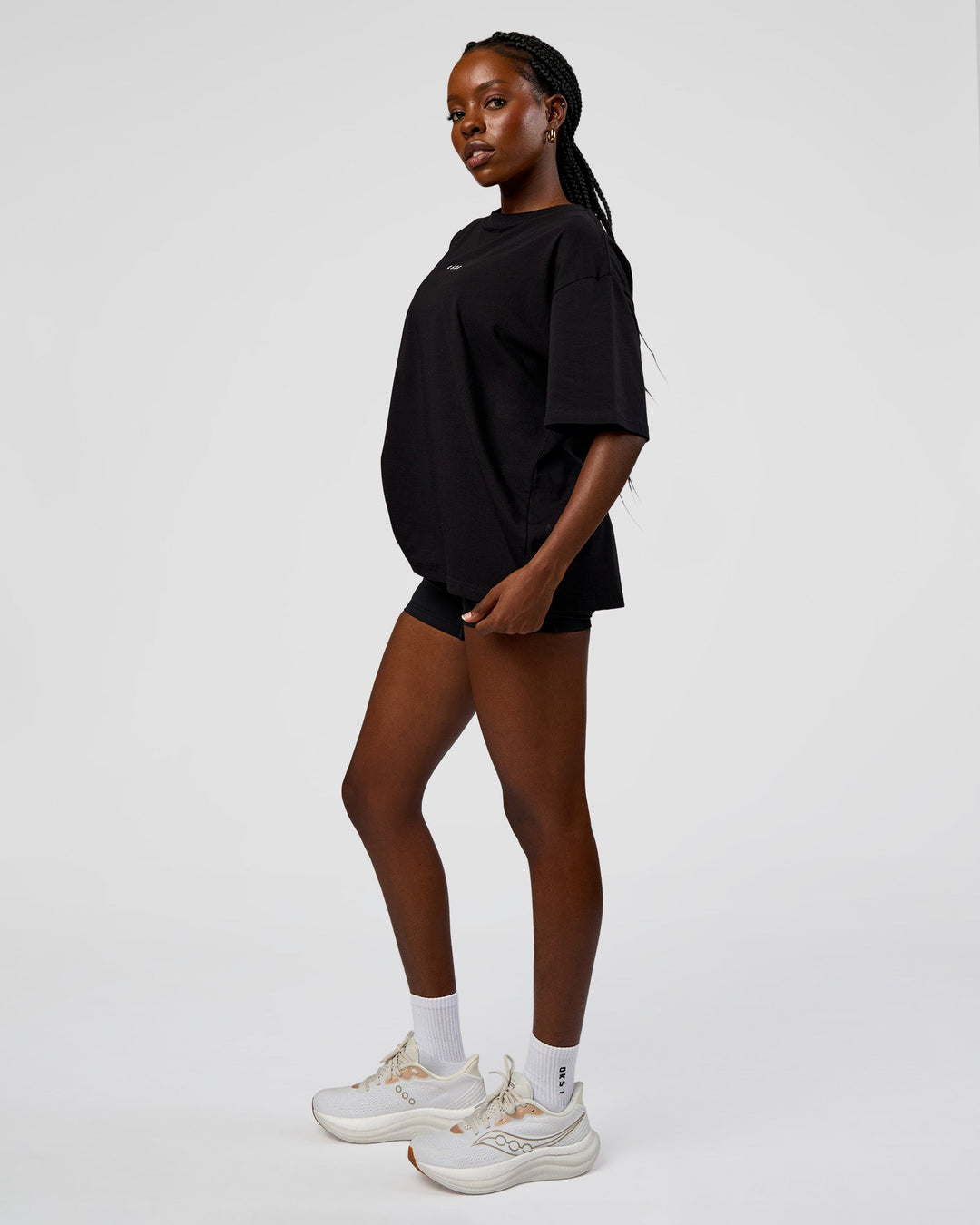 Woman wearing Go-To Run Club FLXCotton Oversized Tee - Black-Marshmallow | Model:Ellie | Size:S - view 3