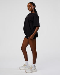 Woman wearing Go-To Run Club FLXCotton Oversized Tee - Black-Marshmallow | Model:Ellie | Size:S | Thumbnail Index: 2