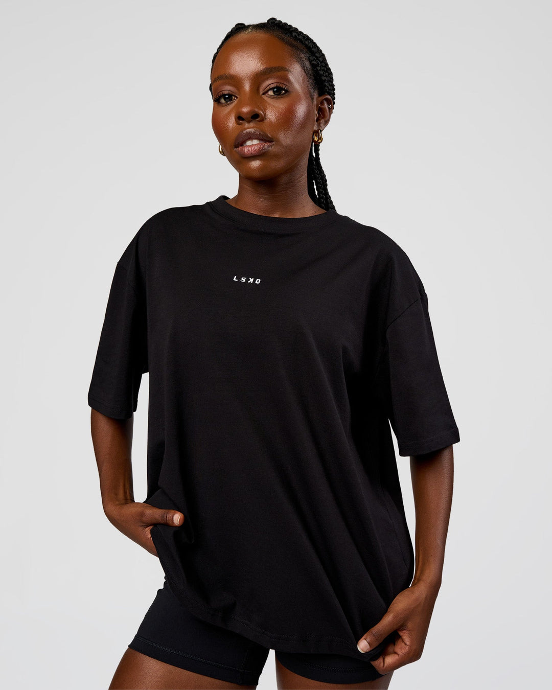 Woman wearing Go-To Run Club FLXCotton Oversized Tee - Black-Marshmallow | Model:Ellie | Size:S - view 2