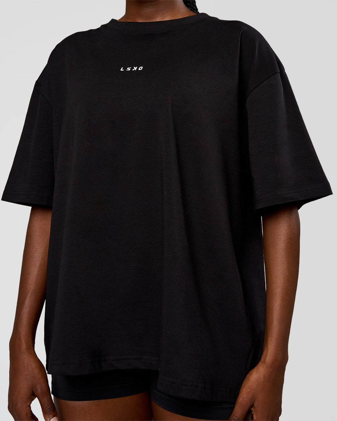 Woman wearing Go-To Run Club FLXCotton Oversized Tee - Black-Marshmallow | Model:Ellie | Size:S - view 4