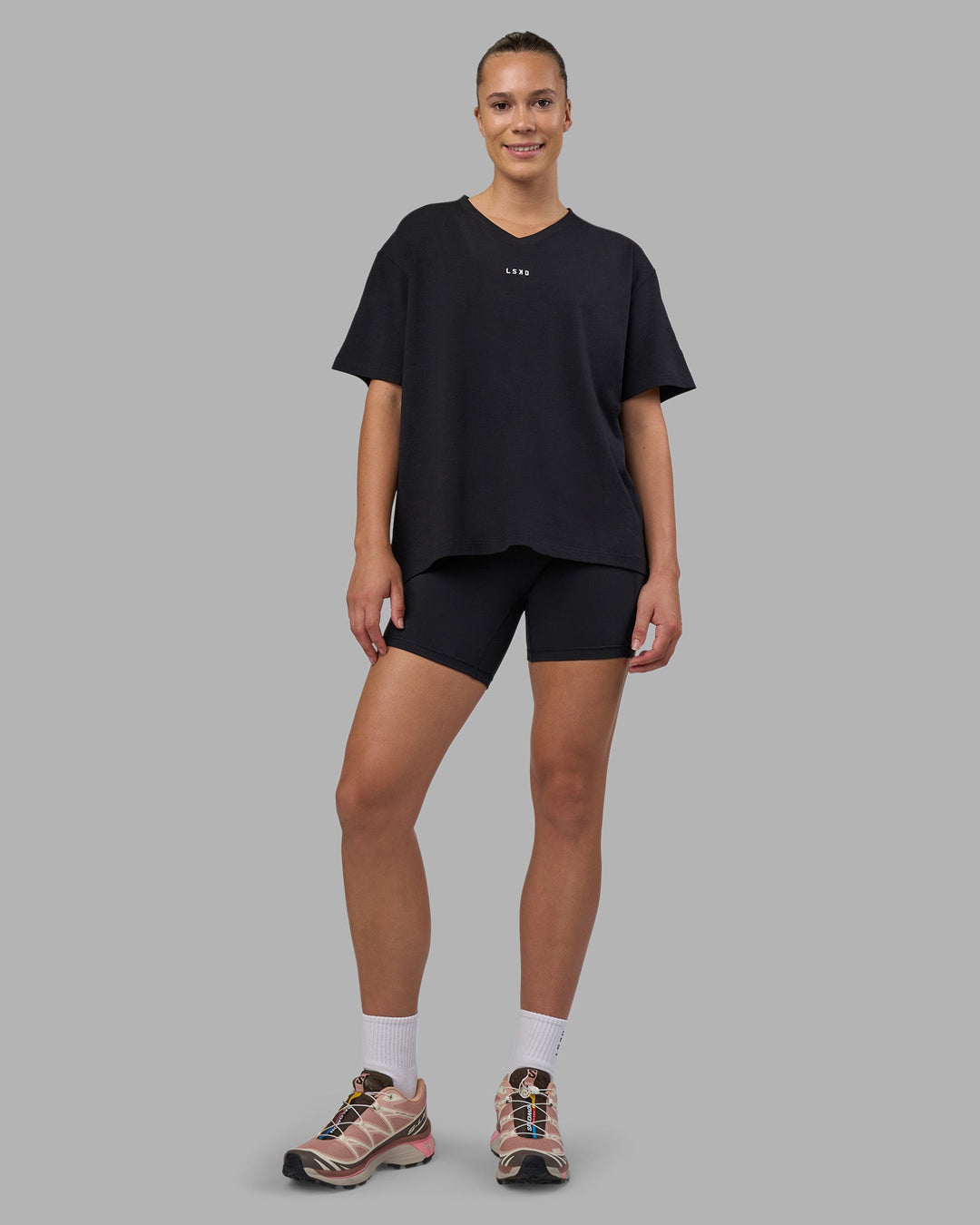 Woman wearing Go-To V-Neck FLXCotton Oversized Tee - Black-White | Model:Charlize | Size:S