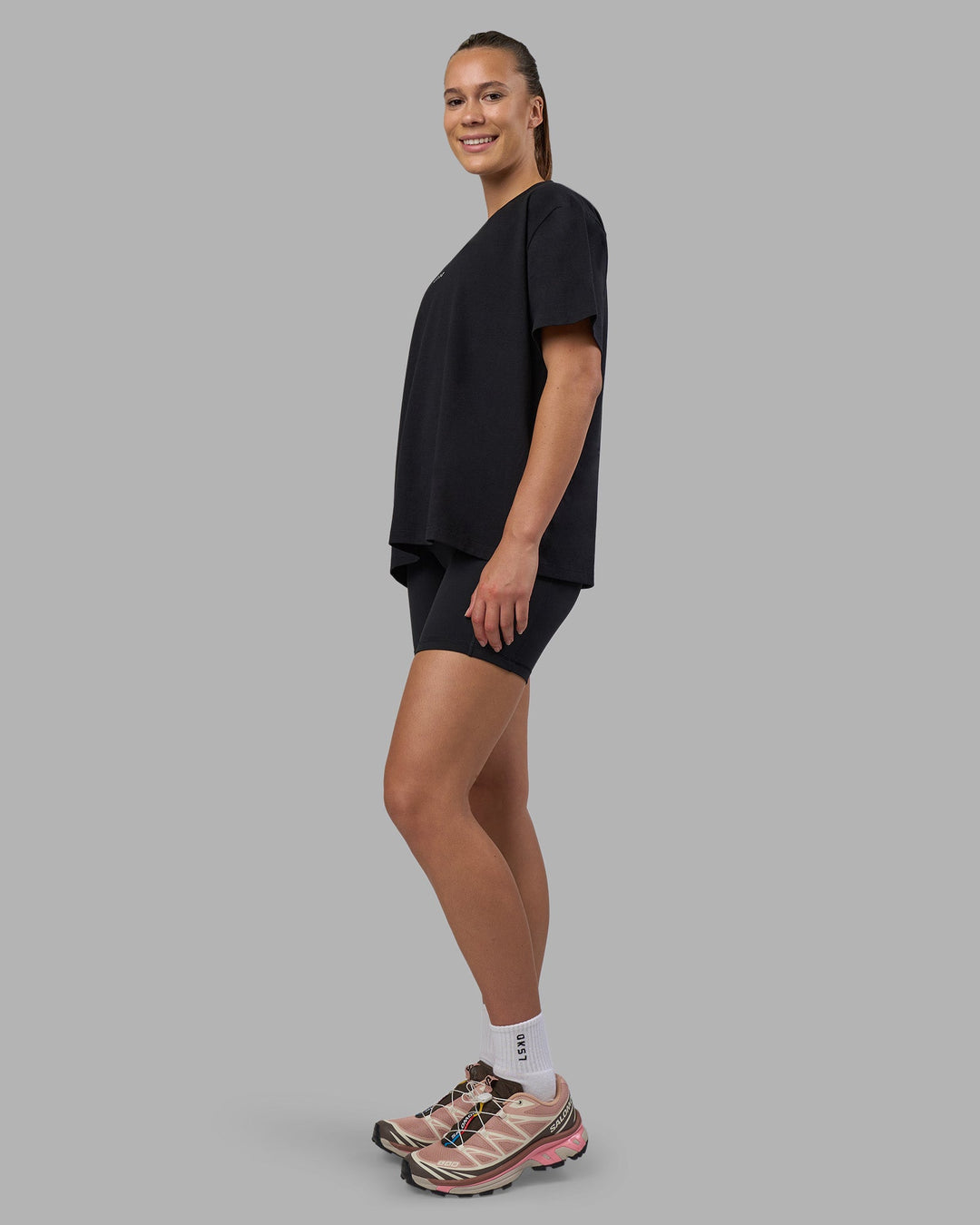 Woman wearing Go-To V-Neck FLXCotton Oversized Tee - Black-White | Model:Charlize | Size:S