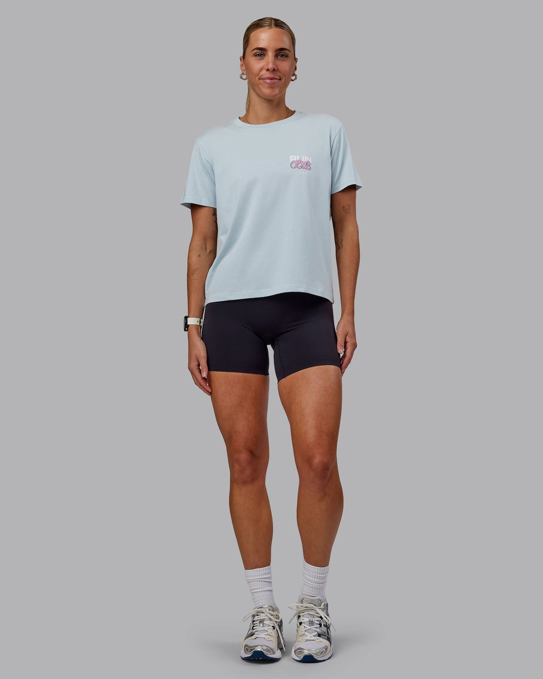 Woman wearing Gone Running FLXCotton Tee - Skyride-Bubblegum