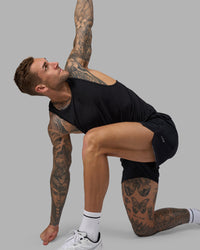 Man wearing Hybrid 5" Short - Black-Reflective | Model:Tommy | Size:S