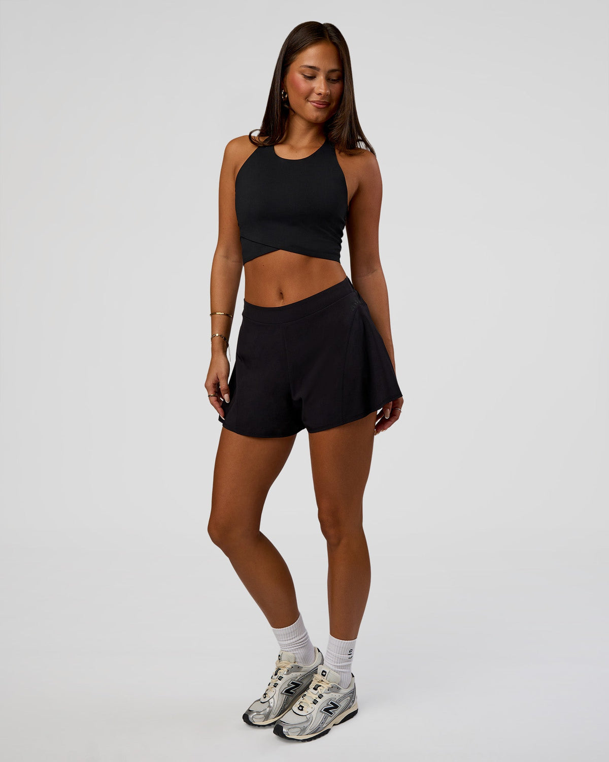 Woman wearing Hybrid Performance Crossover Tank - Black | Model:Bianca | Size:S - view 2