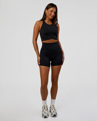 Woman wearing Hybrid Performance Crossover Tank - Black | Model:Bianca | Size:S | Thumbnail Index: 5