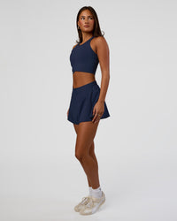 Woman wearing Hybrid Performance Crossover Tank - Future Navy | Model:Bianca | Size:S | Thumbnail Index: 2