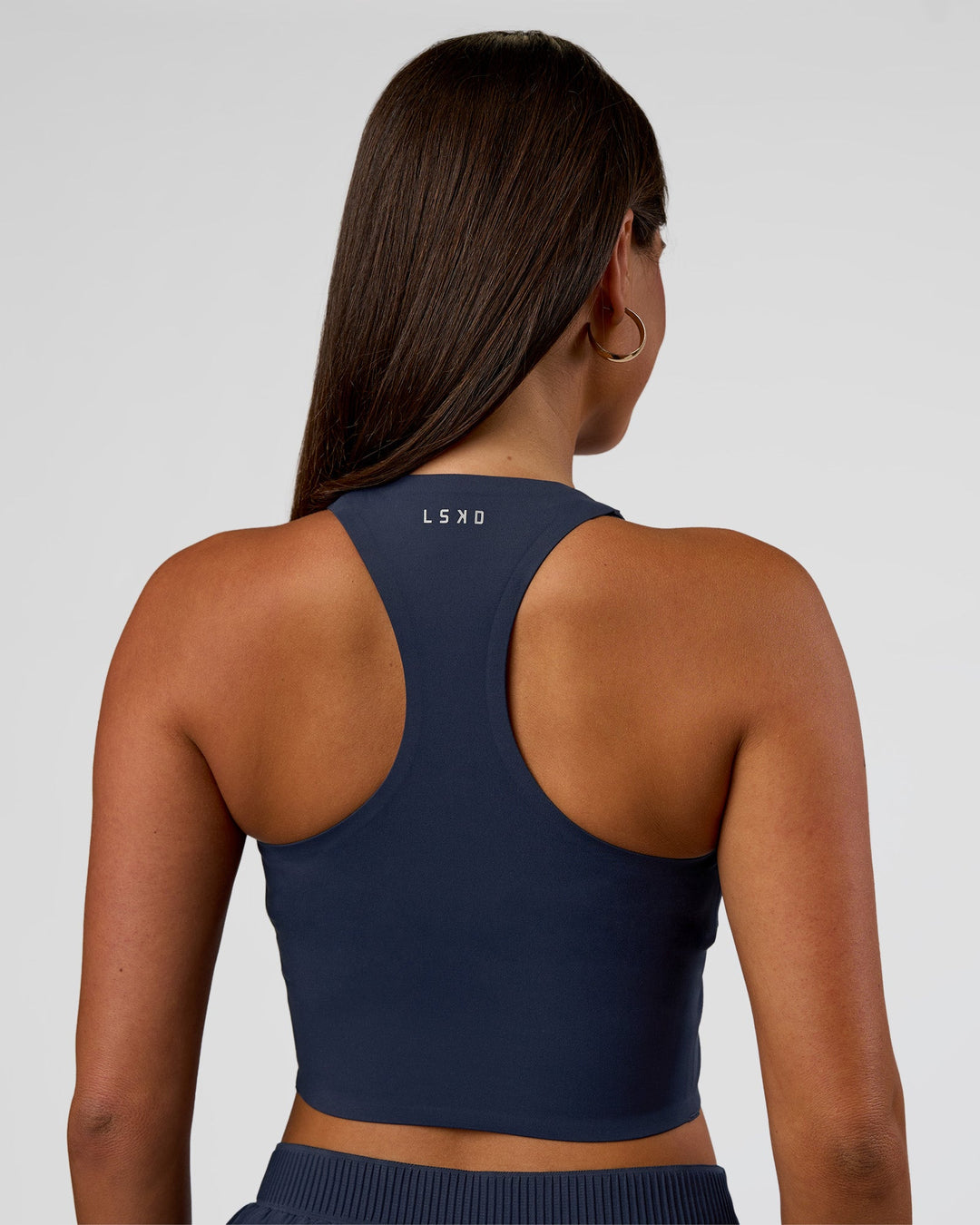 Woman wearing Hybrid Performance Crossover Tank - Future Navy | Model:Bianca | Size:S - view 4