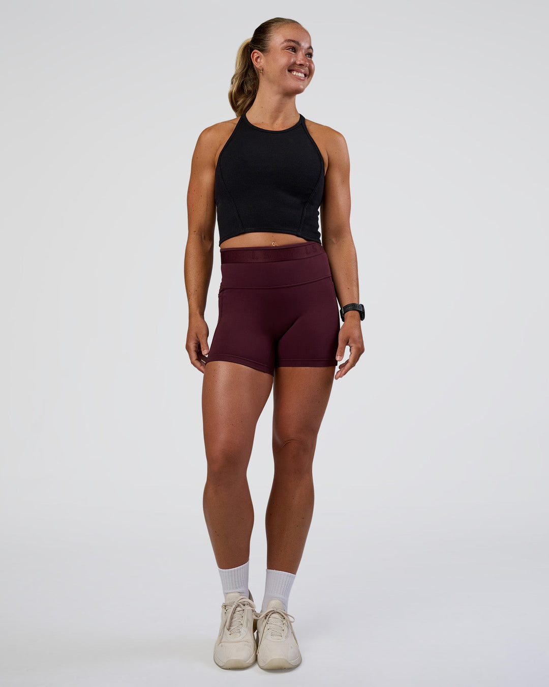 Woman wearing Ignite High Neck Tank - Black | Model:Sav | Size:S