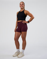 Woman wearing Ignite High Neck Tank - Black | Model:Sav | Size:S | Thumbnail Index: 3