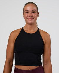 Woman wearing Ignite High Neck Tank - Black | Model:Sav | Size:S | Thumbnail Index: 0