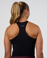 Woman wearing Ignite High Neck Tank - Black | Model:Sav | Size:S | Thumbnail Index: 2