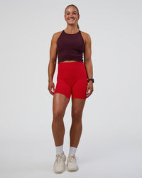 Woman wearing Ignite High Neck Tank - Cherry Lacquer | Model:Sav | Size:S | Thumbnail Index: 5
