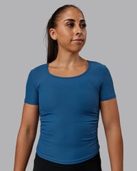 Woman wearing Ignite Ribbed Scrunch Side Cropped Tee - Indigo | Size:S | Model:Tylah | Thumbnail Index: 0