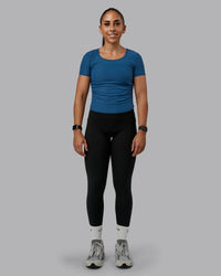 Woman wearing Ignite Ribbed Scrunch Side Cropped Tee - Indigo | Size:S | Model:Tylah | Thumbnail Index: 1