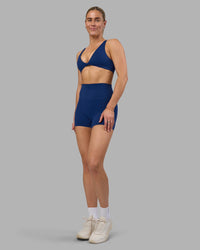 Woman wearing Impulse Reversible Sports Bra - Midnight Blue | Model:Hannah | Size:S | Thumbnail Index: 11