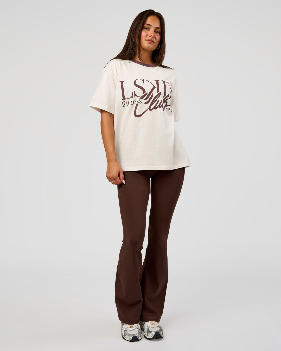 Woman wearing LSKD Fitness Club Heavyweight Oversized Tee - Off White-Cocoa Powder | Model:Bianca | Size:S